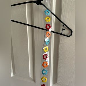 clear/ colorful flower belt. adjustable sizing.